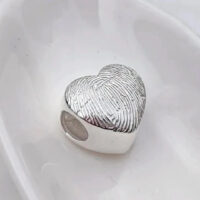 A photo of the KS05 - Textured Heart Charm Bead Memorial from G. Seller